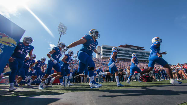 Oct 1, 2022; Lawrence, Kansas, USA; Kansas Jayhawks takes the field for the game against the Iowa State Cyclones at David Booth Kansas Memorial Stadium. Mandatory Credit: William Purnell-USA TODAY Sports